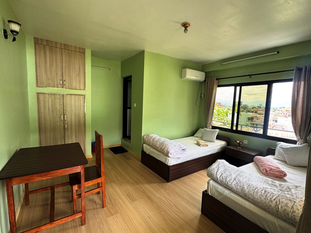 Private retreat room at Niru Yoga Homestay with hot shower and Kathmandu valley view