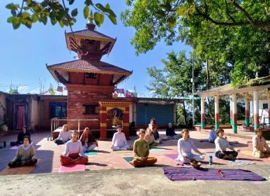 Guest practicing outdoor yoga during one-day wellness retreat at Niru Yoga Homestay in Kathmandu Nepal